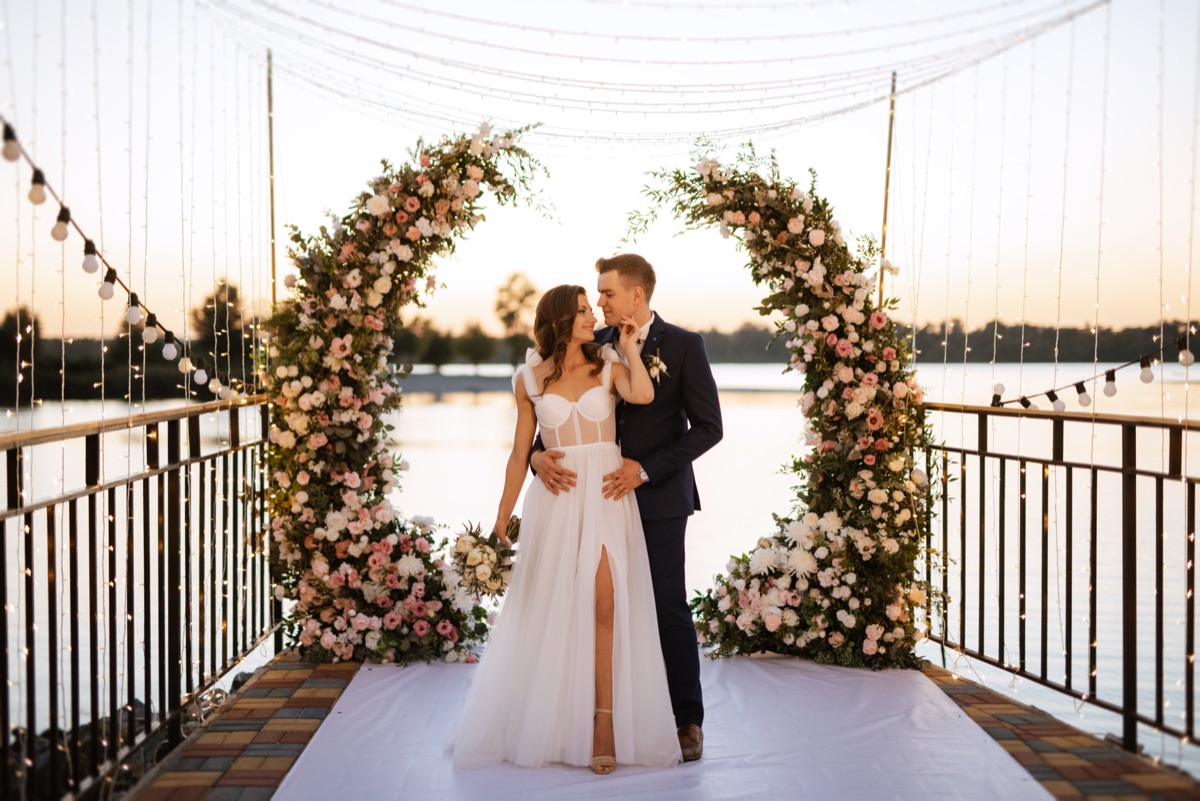 Bride and groom sharing a first dance at a coastal wedding venue